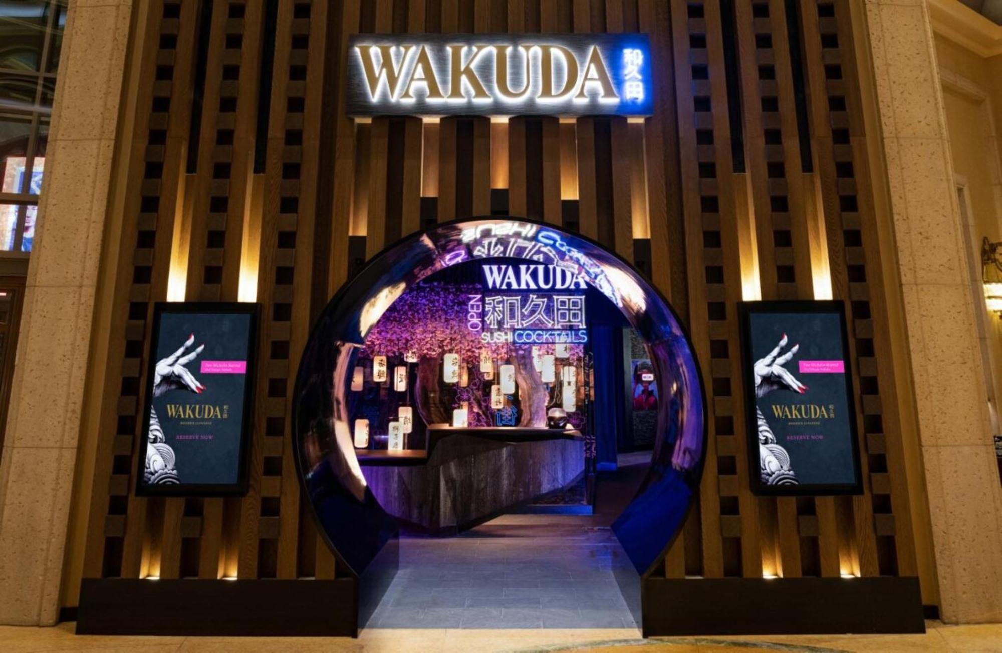 Hotel The Palazzo at The Venetian® Las Vegas Esterno foto The photo showcases the entrance of a restaurant named "Wakuda." The design features a circular archway that leads into the establishment. The entrance is elegantly illuminated, with a blend of warm and cool lighting that highlights the restaurant's 